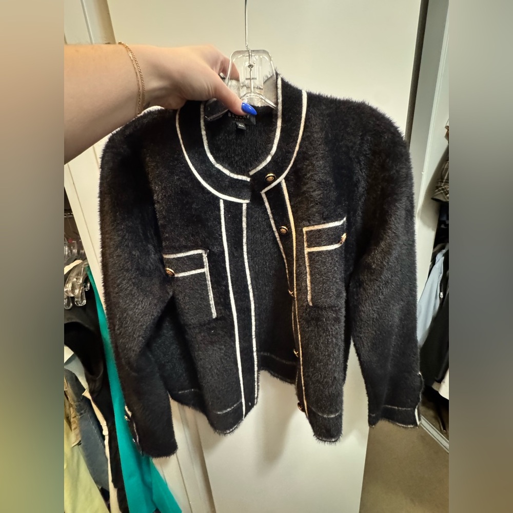Black fuzzy jacket never worn.